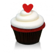 Traditional southern-style red velvet cake and cream cheese icing topped with a little red fondant heart